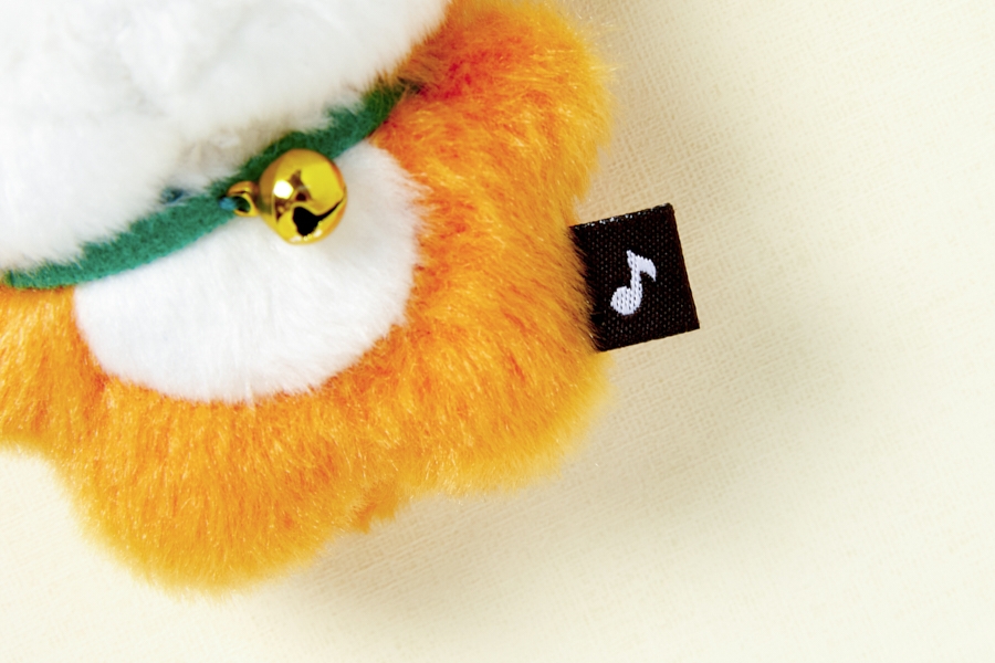 Artbox Bell Fox Mini Keyring close-up of gold bell, green collar and music note tag