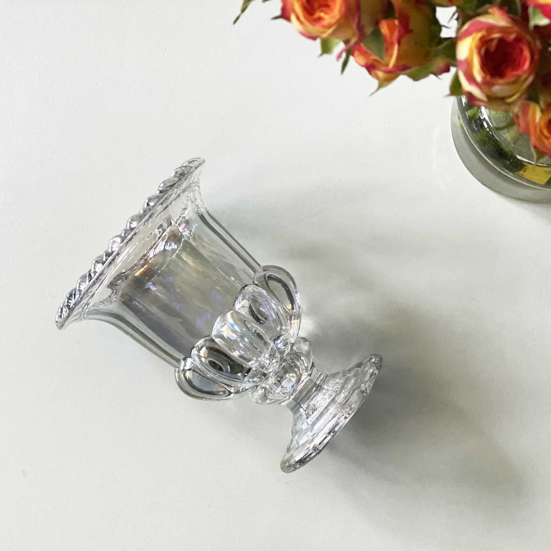 K-Lifestyle coming candle Pumpkin Glass (Random) lying on its side, rim and stem detail