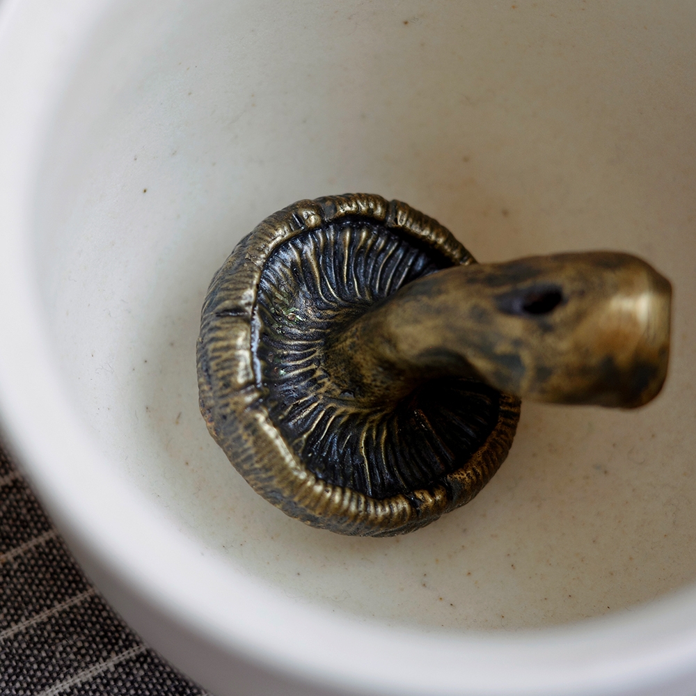 ALLGRAY Mushroom Brass Incense Holder top view of cap gills and stem hole