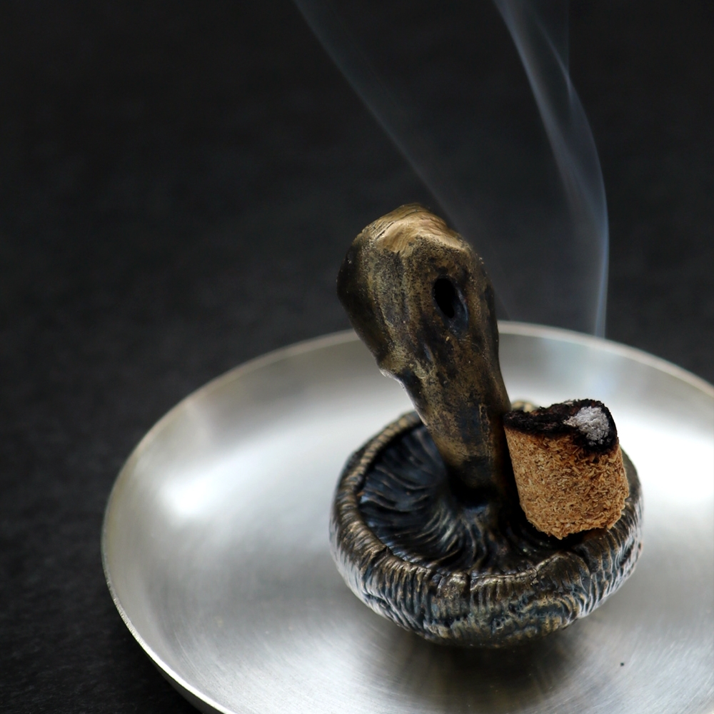 ALLGRAY Mushroom Brass Incense Holder Paperweight with burning incense cone on steel dish