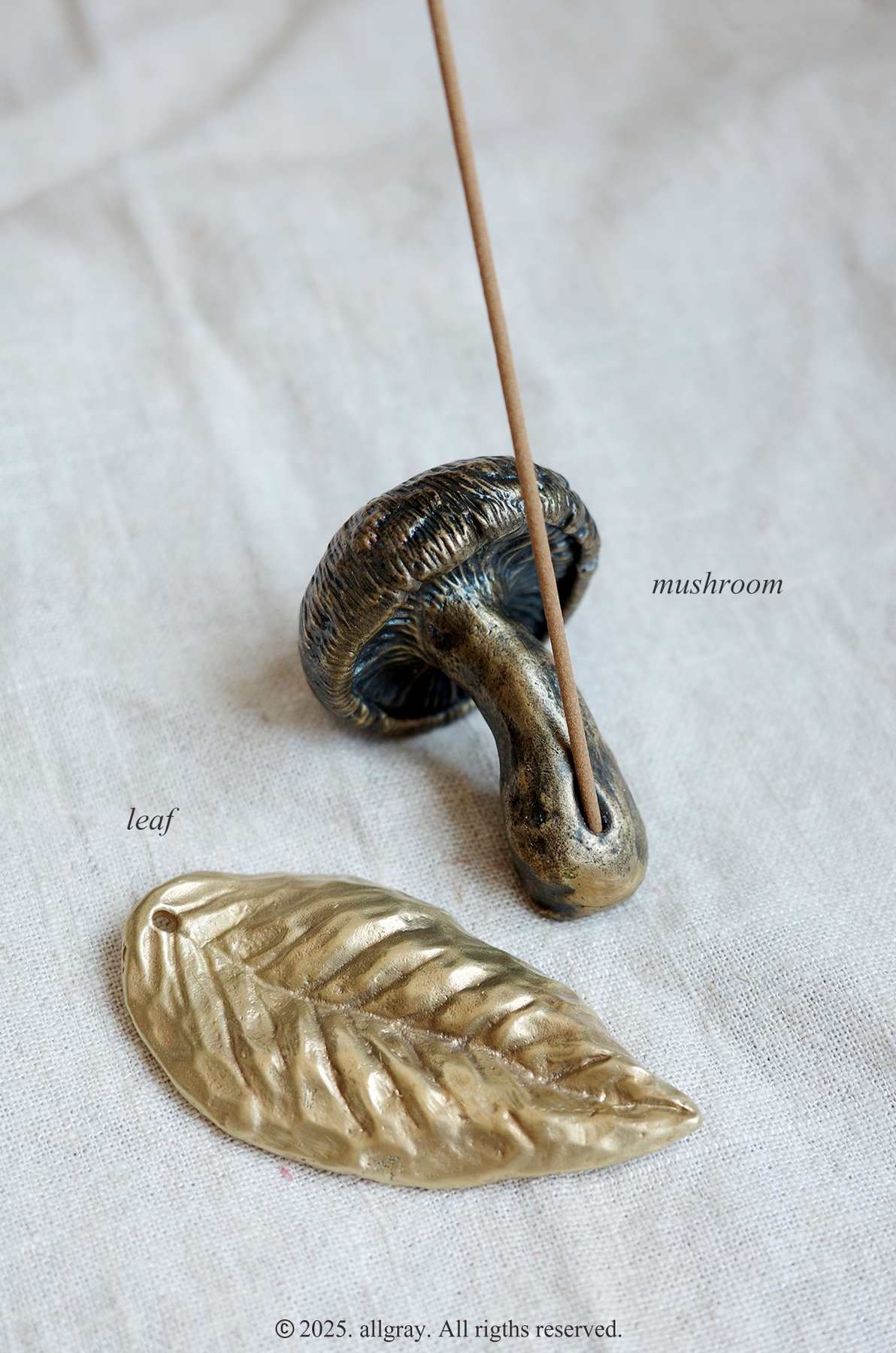 ALLGRAY Mushroom Brass Incense Holder with incense stick, shown beside leaf holder