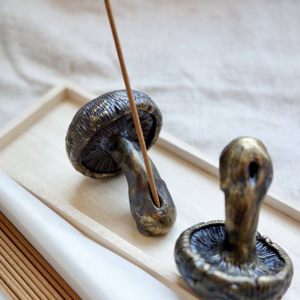ALLGRAY Mushroom Brass Incense Holder holding incense stick, set on wooden tray