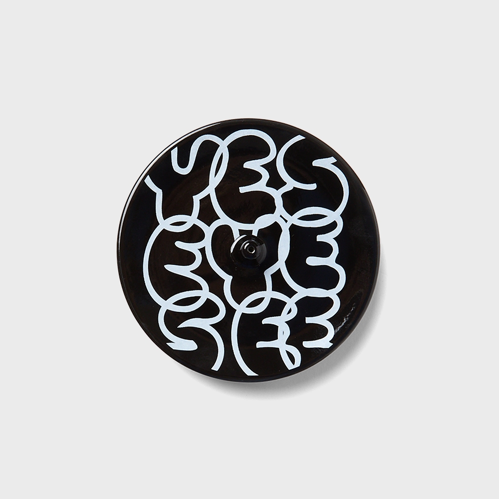 YESEYESEE C-logo Incense Holder Black top view of white logo pattern and center stick hole
