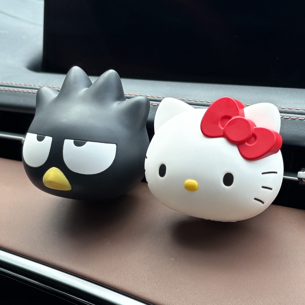 BELLE AMANT Sanrio Car Air Freshener Badtz-Maru and Hello Kitty on car dashboard
