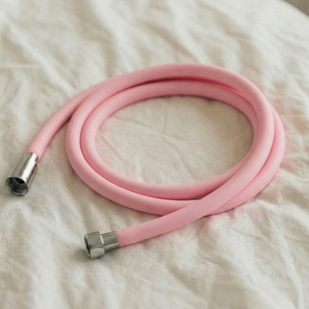 BATHTEM tube shower hose pink with chrome connectors, coiled full length view