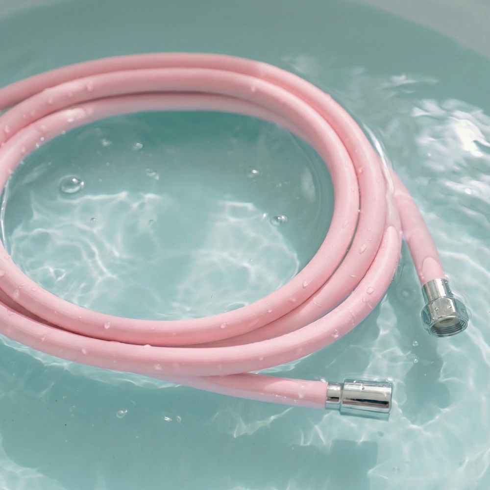 BATHTEM tube shower hose pink in water, water droplets on stain-resistant surface