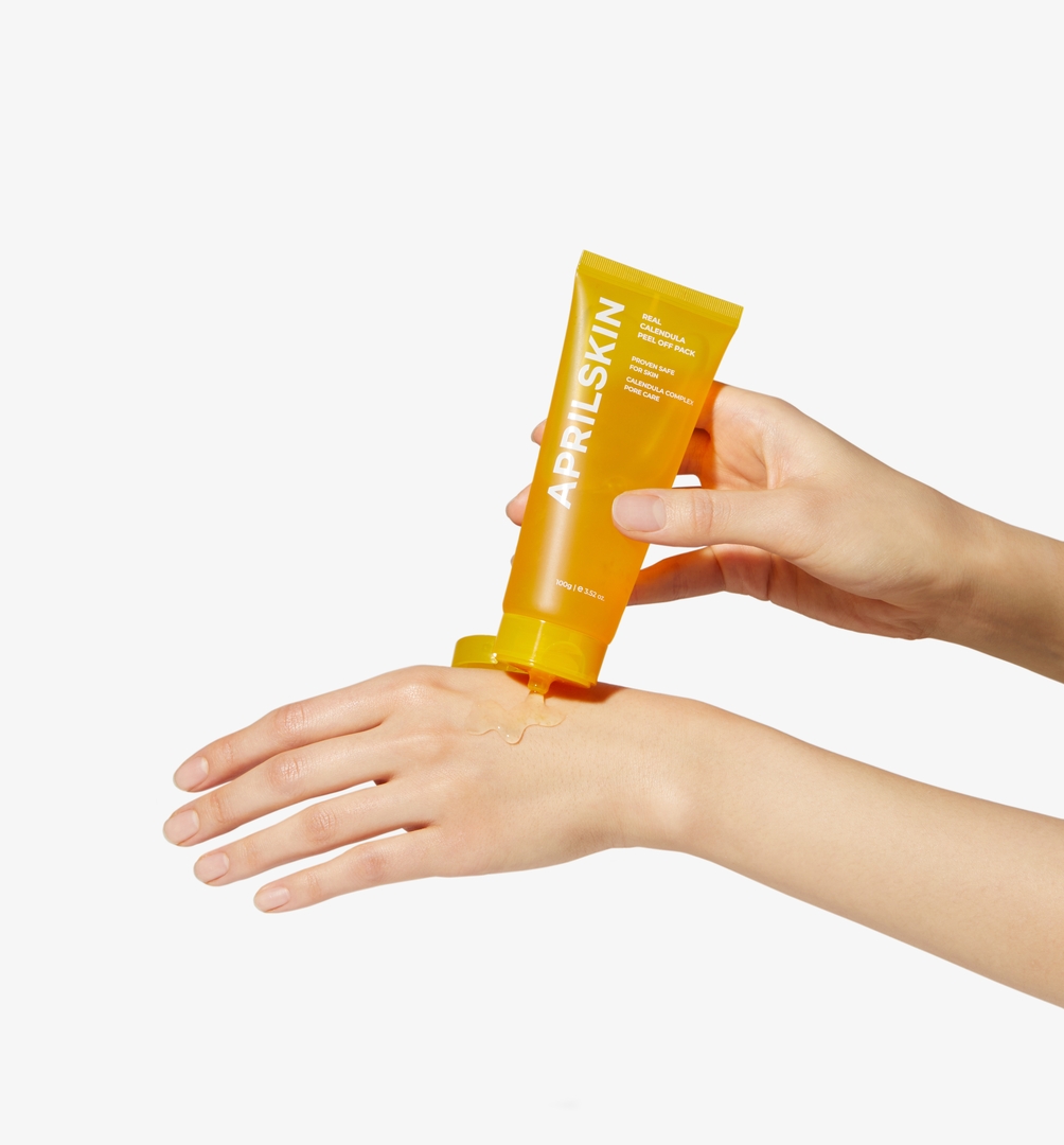 APRILSKIN Real Calendula Peel Off Pack 100g clear gel squeezed onto hand