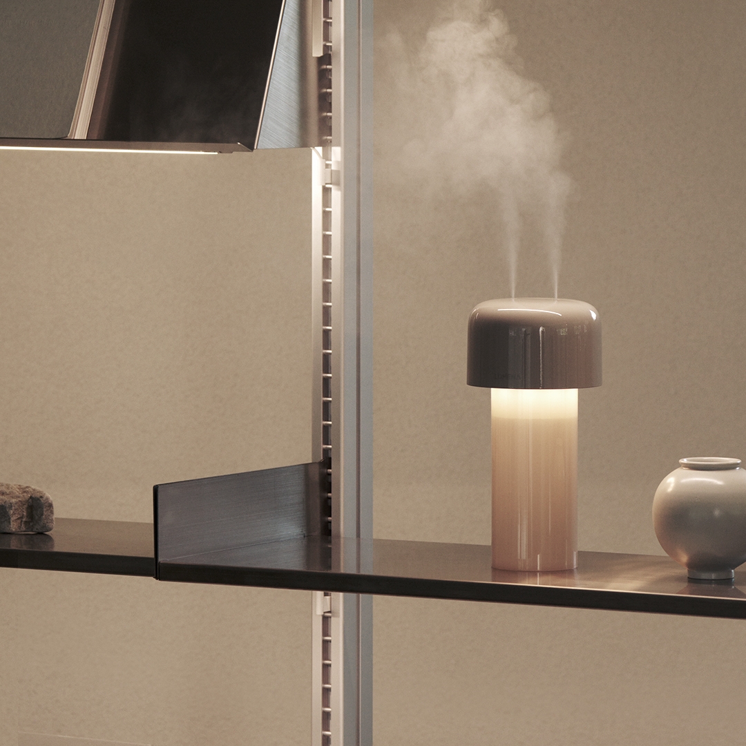 lumena MIST STAND beige humidifier lamp with mist and warm light on a display shelf