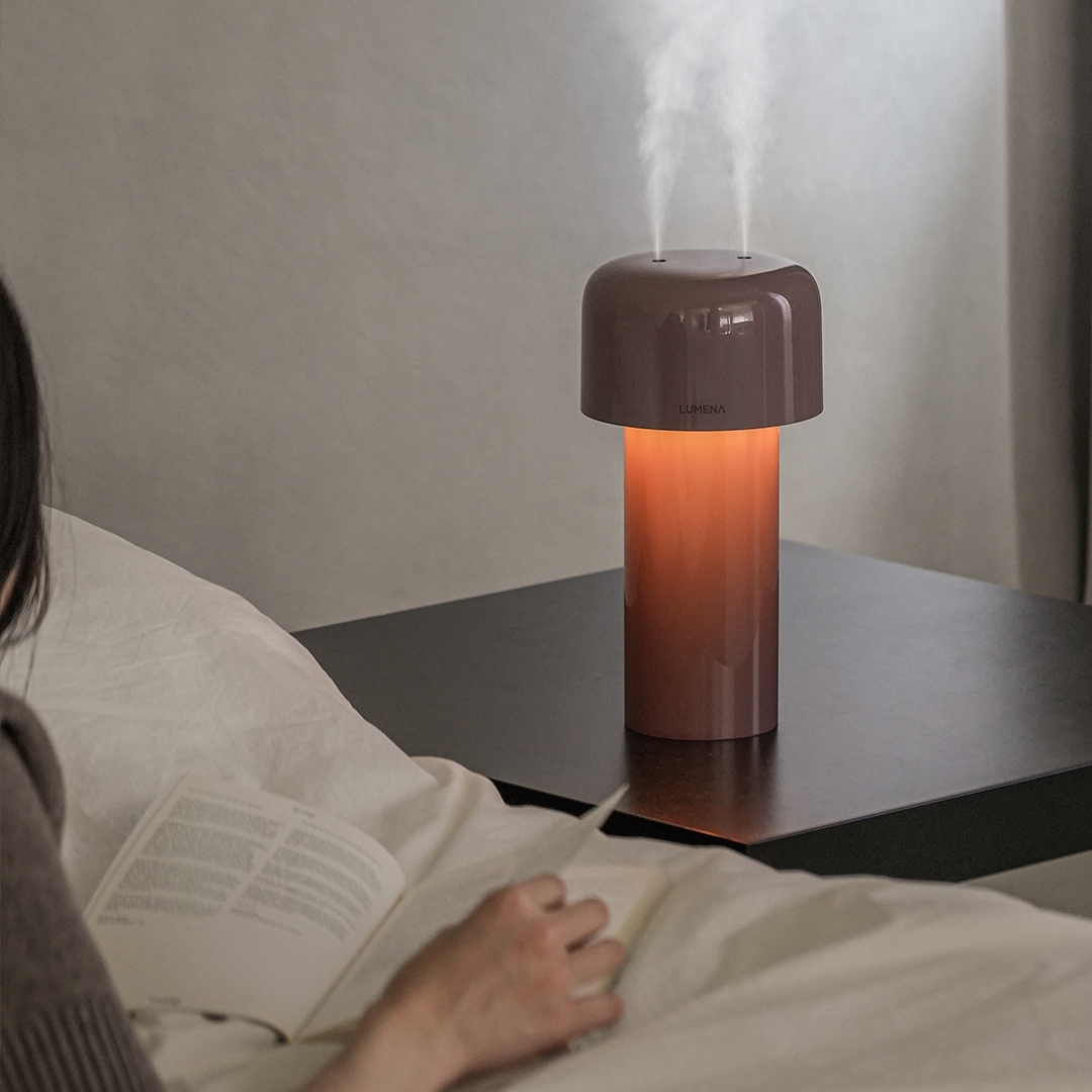 lumena MIST STAND dusty rose humidifier lamp with mist and warm glow on bedside table