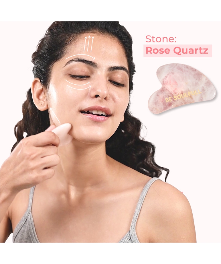 Be Soulfull Rose Quartz Gua Sha on model with upward massage direction arrows