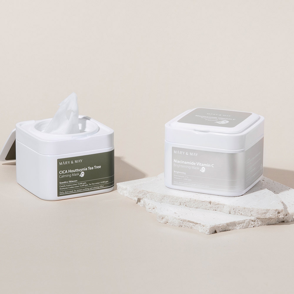 Mary&May Niacinamide Vitamin C Brightening Mask and CICA Houttuynia Tea Tree Calming Mask open tub with sheets