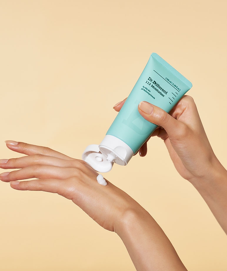 Dr. Different 113 Moisturizer cream being squeezed onto hand, how to apply