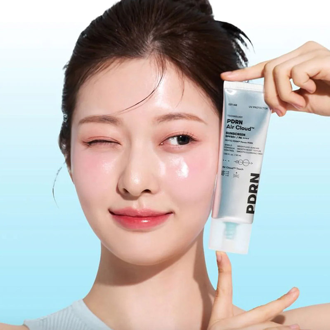 VT PDRN Air Cloud Sunscreen SPF50+ PA++++ 50ml held by model, dewy skin finish