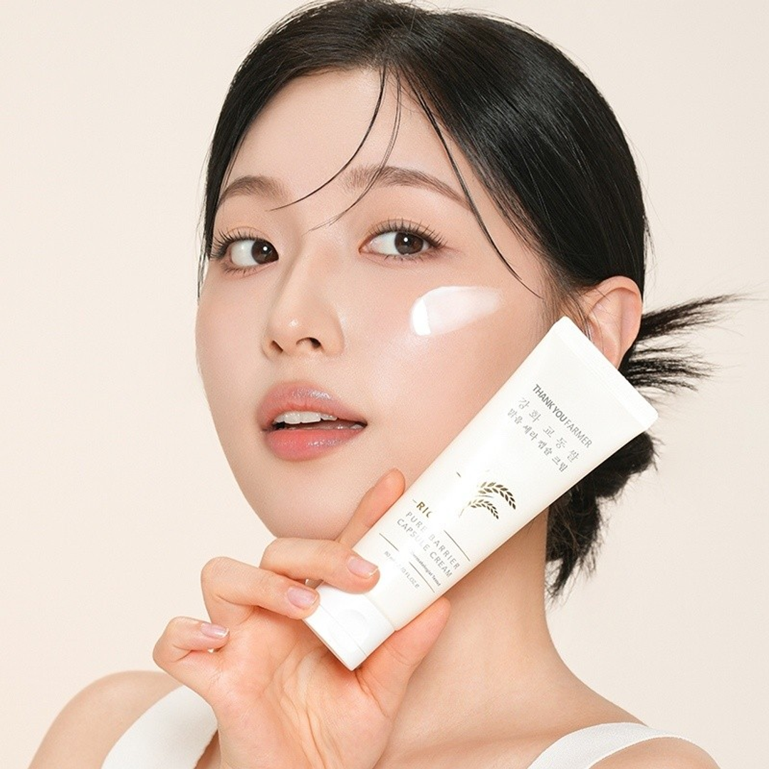 Thank You Farmer Rice Pure Barrier Capsule Cream on model's cheek, skin barrier moisturiser