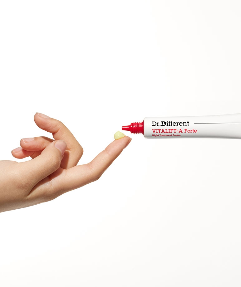 Dr. Different VITALIFT-A Forte Night Treatment Cream pale yellow cream on fingertip