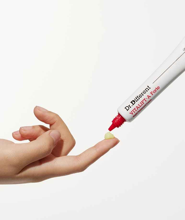 Dr. Different VITALIFT-A Forte Night Treatment Cream dispensing onto fingertip