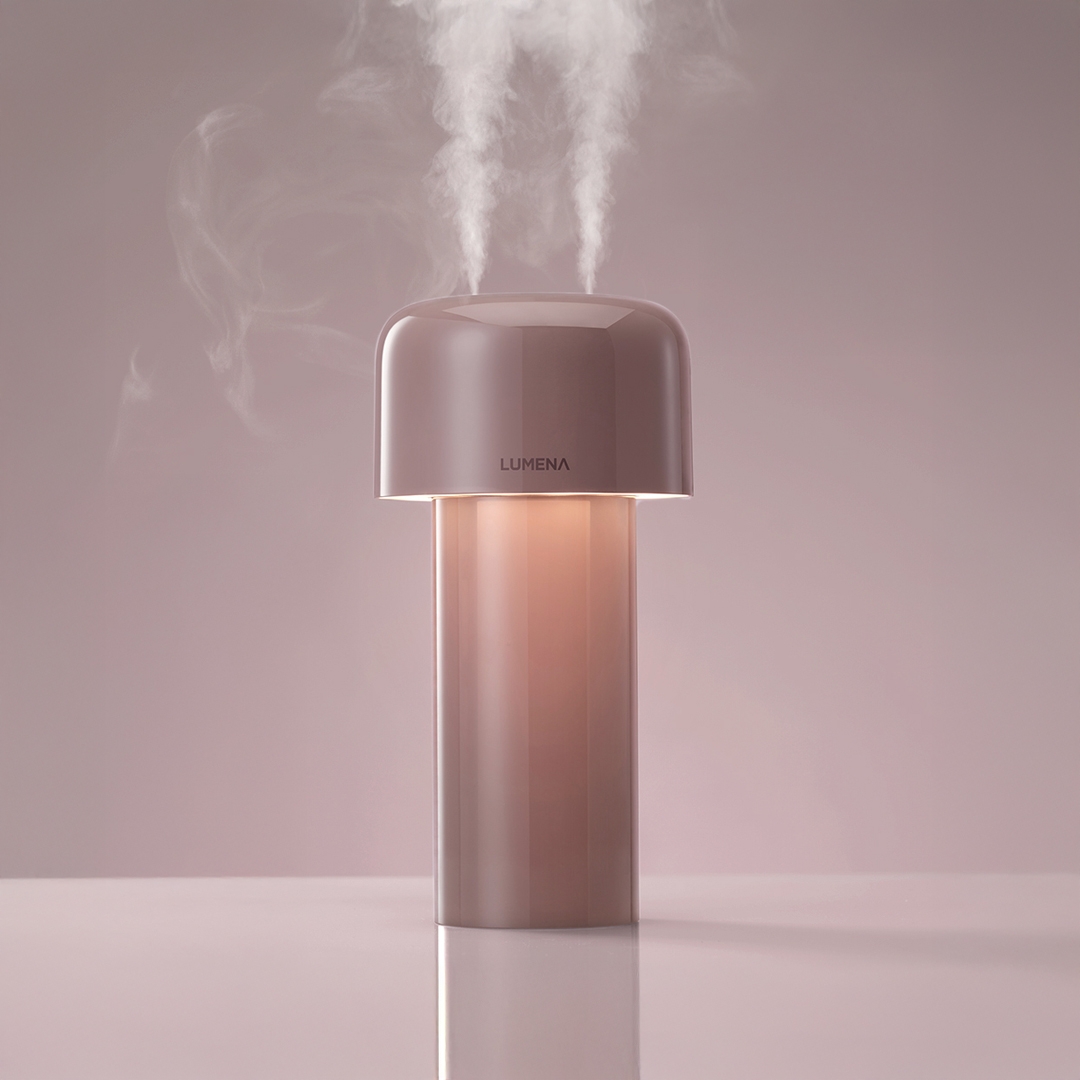 lumena MIST STAND dusty rose humidifier with mist and glowing body, close-up