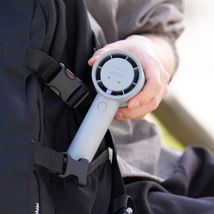 lumena FAN PRO JET handheld fan close-up of front LED panel in use