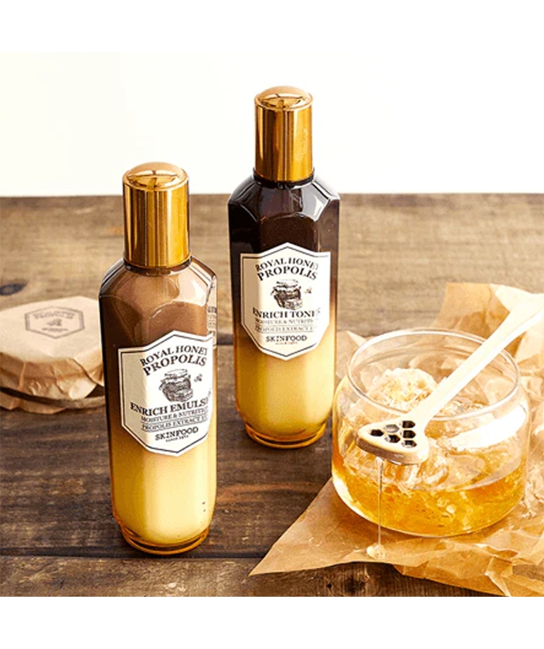 Skinfood Royal Honey Propolis Enrich Toner and Enrich Emulsion bottles with honey