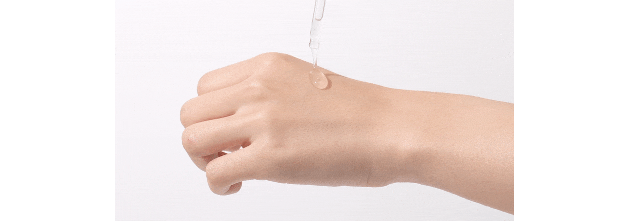 REJURAN Derma Healer Moisture Treatment Ampoule dropper serum drop on back of hand